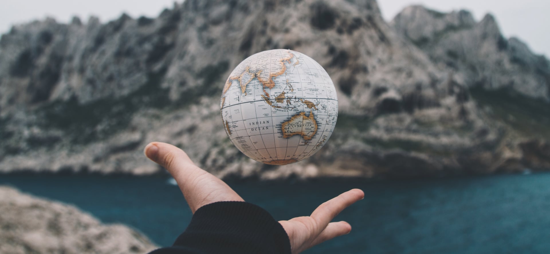 Hand holding globe representing international enterprise security